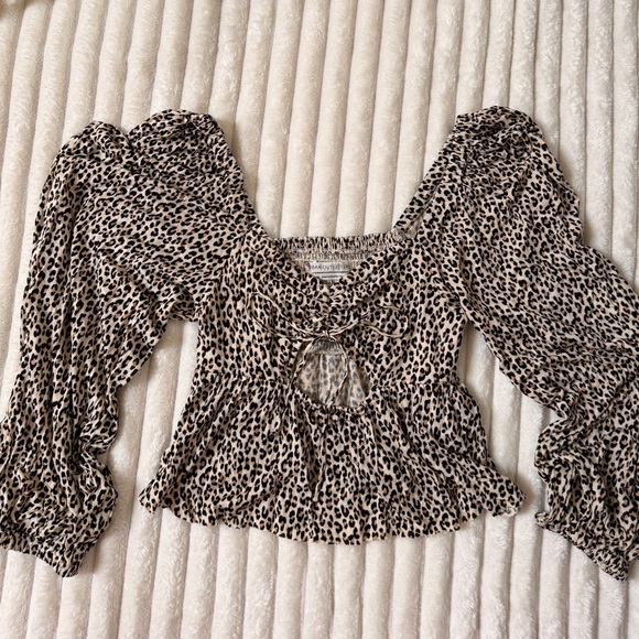 Urban Outfitters Tops - Urban Outfitters leopard peplum top
Size S | NWOT